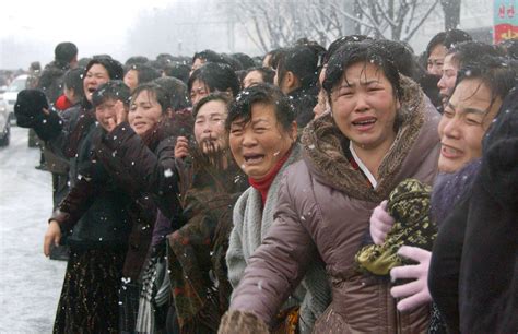 North Koreans Cry Salute As Kim Jong Un Escorts Hearse Carrying Late Kim Jong Il In Snowy