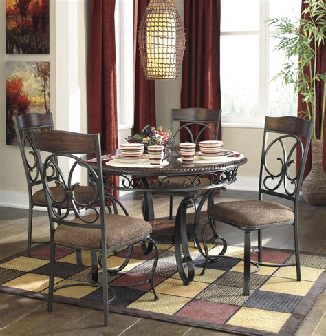 Dining sets are available in all shapes sizes heights and materials and typically include the table and at least four chairs. Signature Design by Ashley Glambrey Brown 5 Piece Dining ...