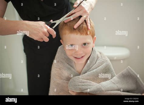Caucasian Mother Giving Son Haircut Stock Photo Alamy