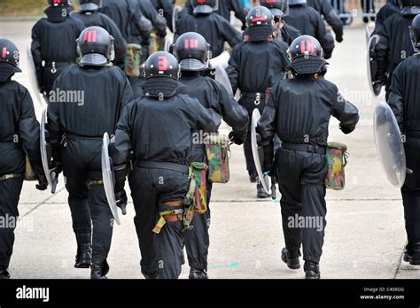 Riot Squad Police Officers Forming A Protective Barrier With Riot Shields During Exercise Of The