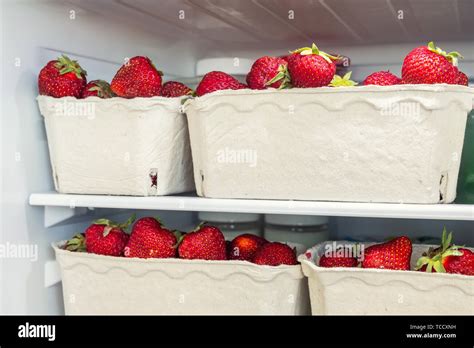 Refrigerator Shelf With Organic Juicy Strawberries In Bio Recycled