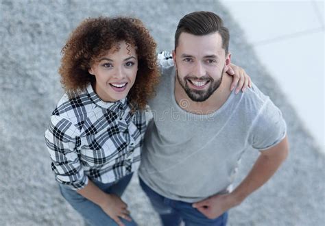 Young Couple Give Each Other Five In New Living Room Stock Image