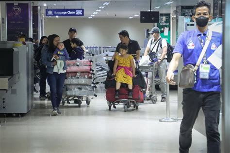 72 filipinos return home from war torn sudan the manila times
