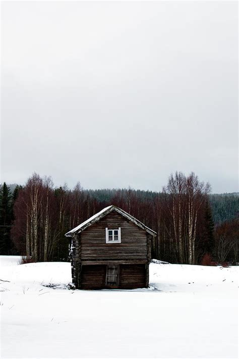 Tiny Wooden House On A Snow Clad Meadow Photograph By Ulrich Kunst And