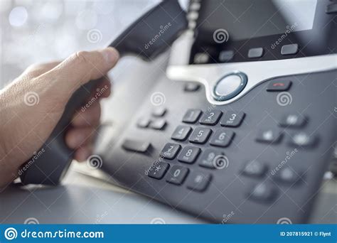 Dialing A Telephone In The Office Concept For Communication Contact Us