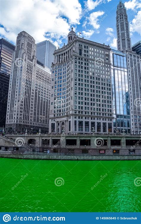 Chicago Skyline Towering Over A Dyed Green Chicago River Editorial