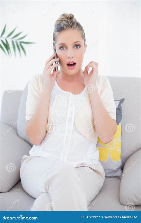 Surprised Fresh Blonde In White Clothes On The Phone Stock Image Image Of Living Length 34389927