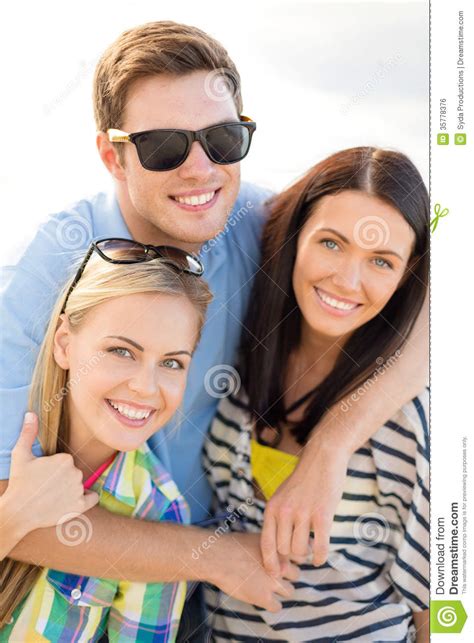 Group Of Friends Having Fun On The Beach Stock Photo Image Of Company