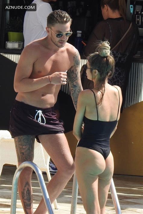 Chloe Sims Talks To A Tattooed Sam Mucklow By The Pool At A Hotel In