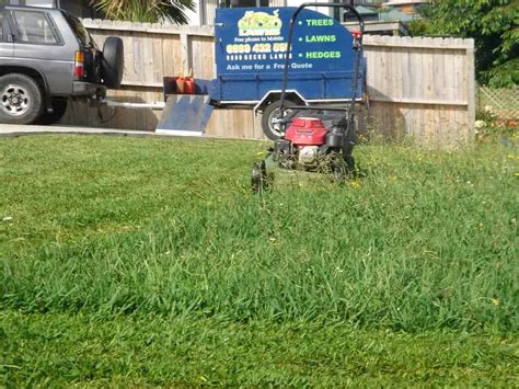 Lawn mowing is a routine activity sometimes combined with other lawn maintenance tasks. Start up lawn care trailer in action
