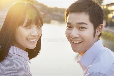 Young Chinese Lovers Embracing By River Stock Photo Image Of Romance