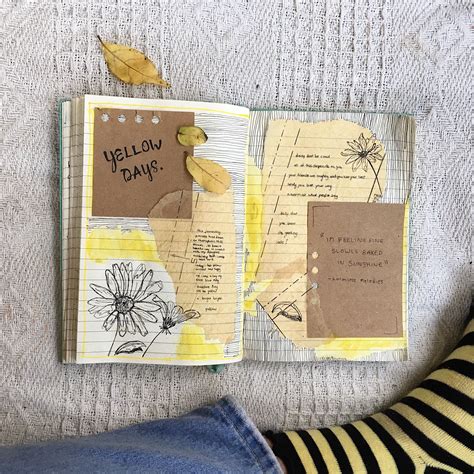An Open Notebook With Yellow Flowers And Some Writing On The Pages Next
