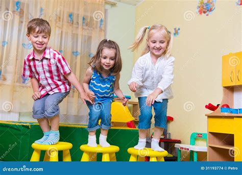 Group Of Happy Preschool Kids Jumping Stock Images Image 31193774