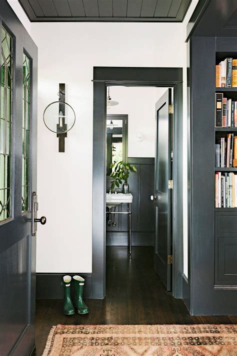 The doors themselves are a trim paint, but they can remain as stained wood or match the lighter color wall. Trend Spotting: Painted Trim | Dark trim, Painting trim ...