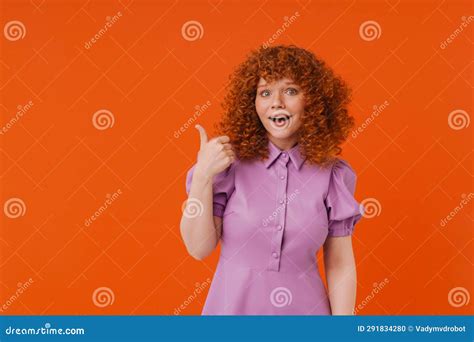 White Excited Woman With Ginger Hair Showing Thumb Up At Camera Stock