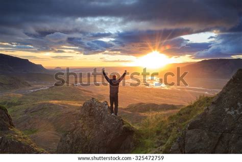 Man Standing On Ledge Mountain Enjoying Stock Photo Edit Now 325472759