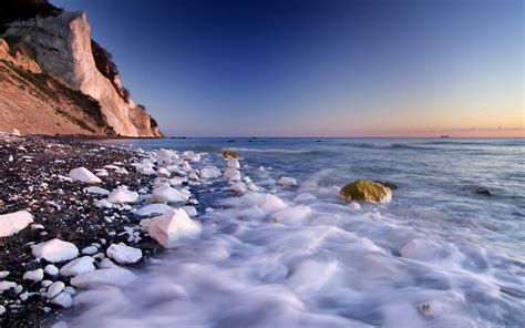 Masaüstü Güneş ışığı Manzara deniz Kaya Kıyı kum Yansıma kar