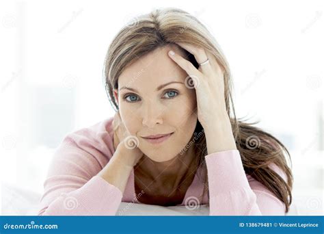 Gorgeous Middle Aged Woman Lying Down Looking At Camera Portrait