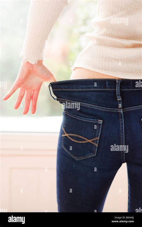 Woman Pulling Down Pants Hi Res Stock Photography And Images Alamy