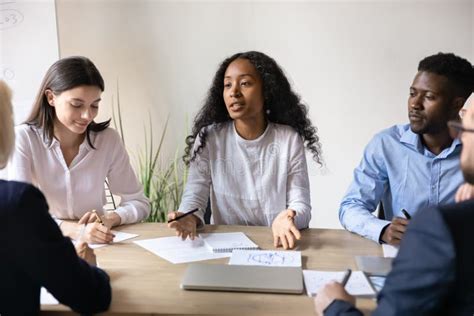 African American Businesswoman Brainstorm With Diverse Colleagues At Meeting Stock Image Image