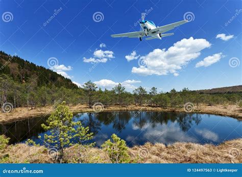 Exploring The Wilderness Small Aircraft Flying Above Scenic Vi Stock