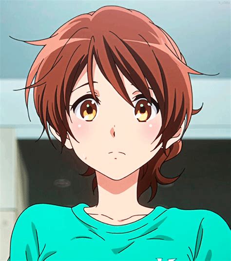 An Anime Character With Brown Hair Wearing A Green T Shirt And Looking At The Camera