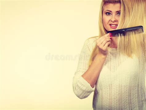 Blonde Woman Brushing Her Long Hair With Comb Stock Image Image Of