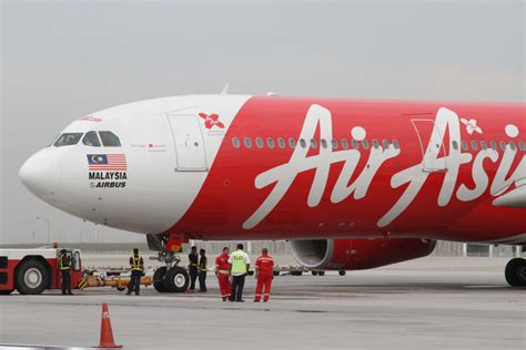 The flight attendants of airasia malaysia wear a set uniform that incorporates the company's bright red color. X marks the spot: AirAsia X Indonesia is no more