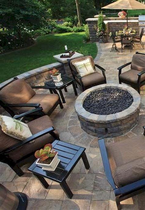 Bench fire pit seating for a large gathering of people with several rows of benches around a circular fire pit in sunken fire pit area. 50 Marvelous DIY Fire Pit Ideas and Backyard Seating Area ...