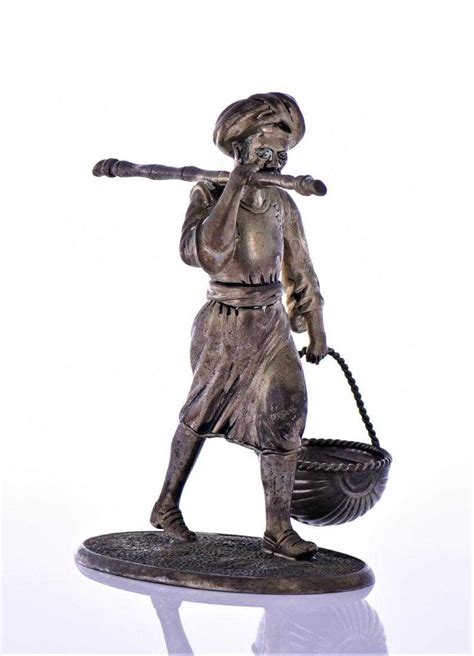 Brass Sculpture Of An Indian Farmer Hold