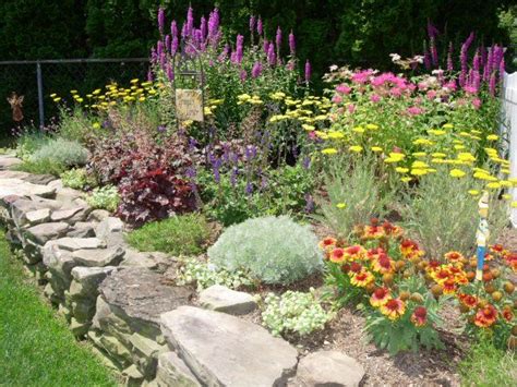 Perennial Flower Garden With A Rock Border Wall Perennial Garden