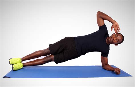 Sporty Man Doing Side Plank Exercise