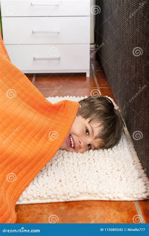 Playful Child Is Hiding Under The Bed Stock Photo Image Of Happy