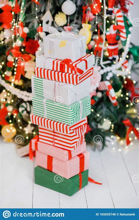 Pile Of Wrapped Presents Under The Christmas Tree Stock Photo Image