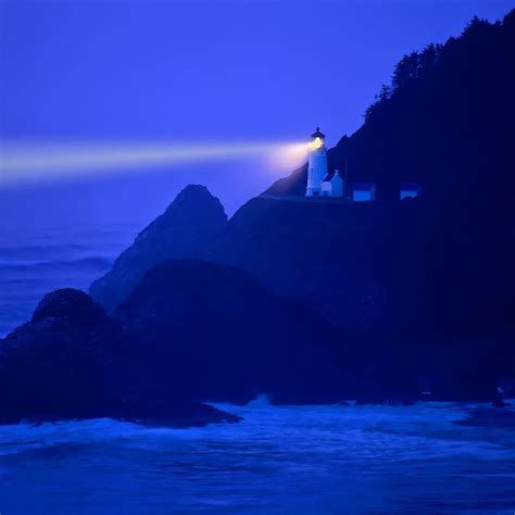 Lighthouse Beams Across Stormy Night Sea Heceta Head Or