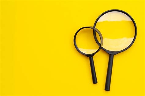 Premium Photo Magnifying Glasses On Yellow