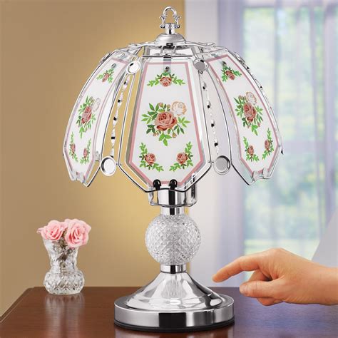 The panel of the touch lamp is made of glass. Rose Garland White Glass Panel Touch Lamp | Collections Etc.