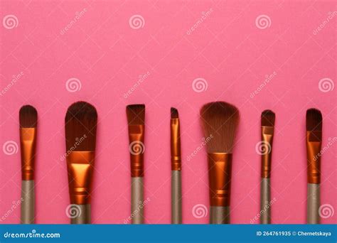 Set Of Makeup Brushes On Pink Background Flat Lay Space For Text