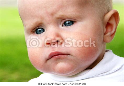 Baby Taken Closeup With Sad Face Canstock