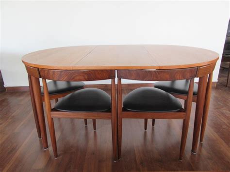 Enjoin a round table discussion with our exquisitely built office meeting table and chair set. Rare Hans Olsen Teak Table with Leaf and Six Chairs That ...