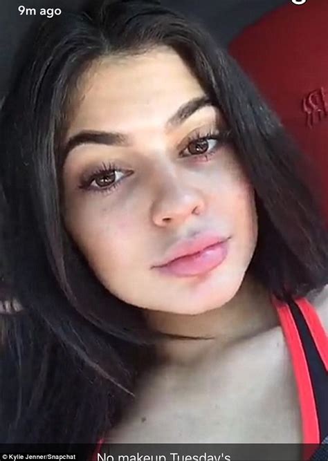 Kylie Jenner Bares Her Midriff In Tiny Sports Bra As She Pouts On