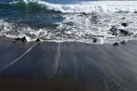Black Sand At Glass Beach In Eleele On Kauai Island In Hawaii Stock