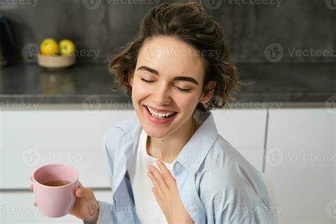 Happy Mornings Portrait Of Happy Brunette Woman Drinks Cup Of Coffee