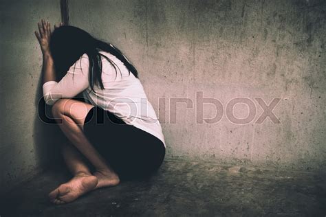 A Woman Sitting Alone And Depressed Stock Image Colourbox