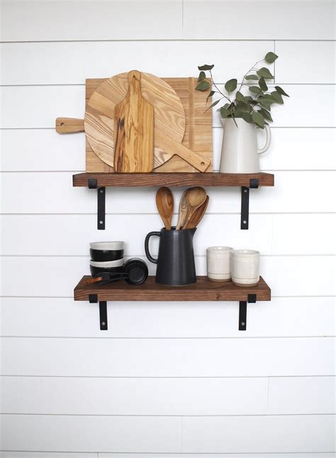 Read on to learn how to install floating shelves. Black Metal Bracket Shelves, Floating Shelves, Open ...