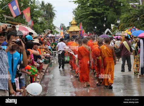 Watering the monks at Pi Mai Lao the Lao New Year Festival in UNESCO ...
