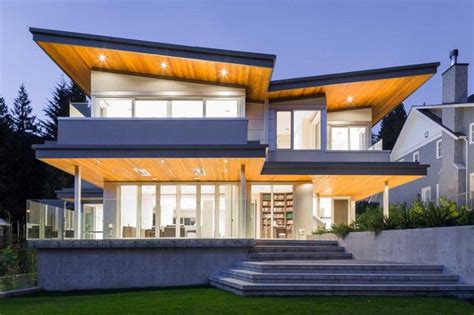 The butterfly roof is a result of deliberation to satisfy two design conditions: A Butterfly Roof And Dramatic Lighting Give This Home A ...
