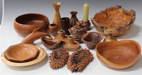 A Collection Of Turned Wood Objects Including A Goblet And A