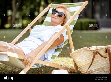 Carefree Mature Woman Sunbathing Hi Res Stock Photography And Images