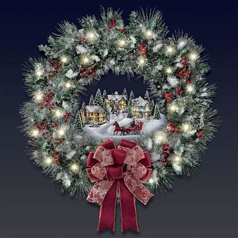 The Thomas Kinkade Illuminated Holiday Wreath Hammacher Schlemmer